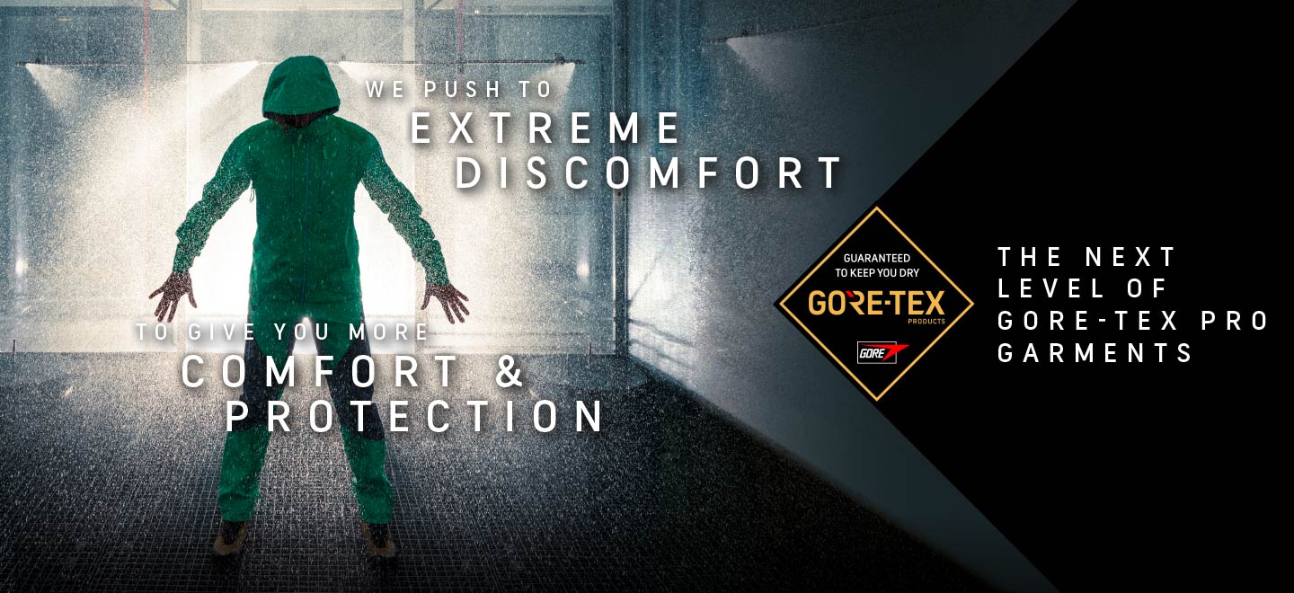man wearing Gore-Tex PRO stood in rain chamber